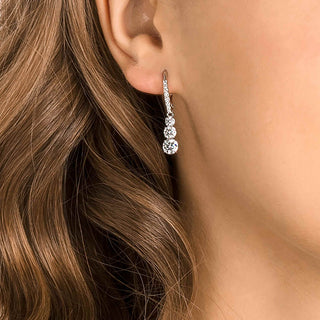 Stilla Attract hoop earrings, Round cut, White, Rhodium plated